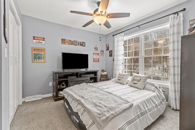 carpeted bedroom featuring ceiling fan