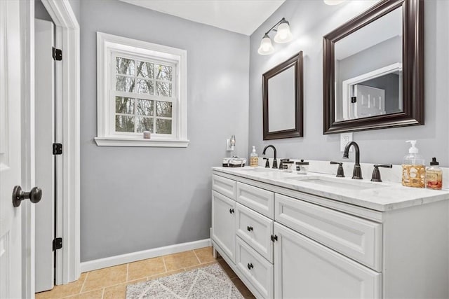 bathroom with tile patterned flooring and vanity