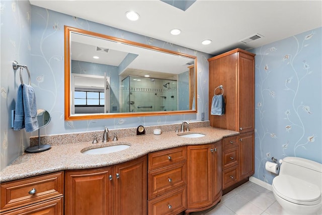 bathroom with toilet, tile patterned flooring, walk in shower, and vanity