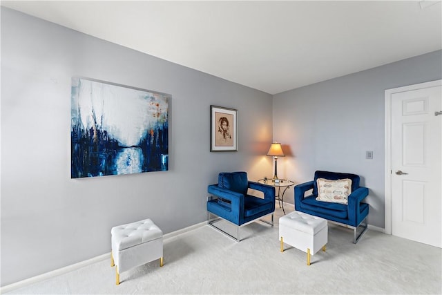 sitting room with carpet flooring