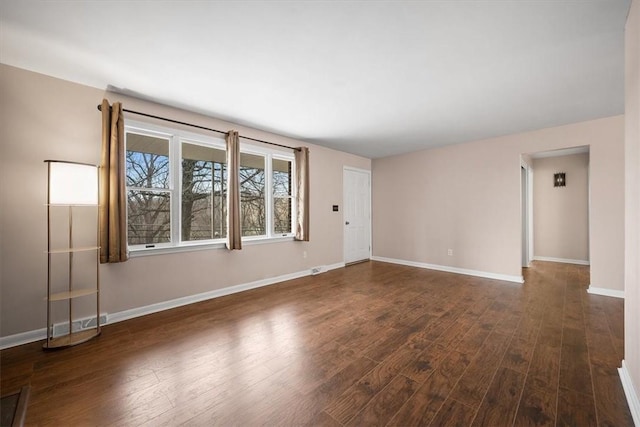 spare room featuring dark hardwood / wood-style floors