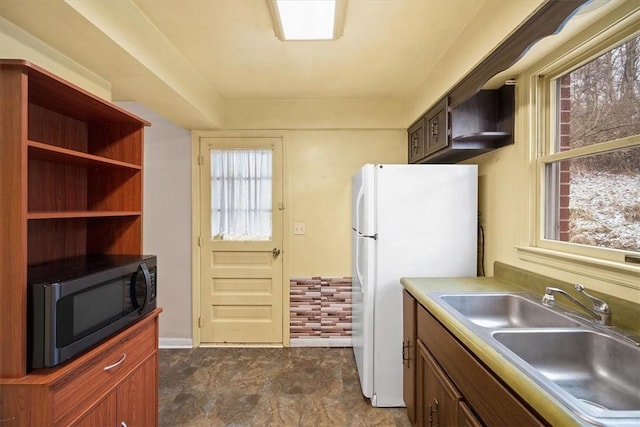 kitchen featuring sink and white refrigerator