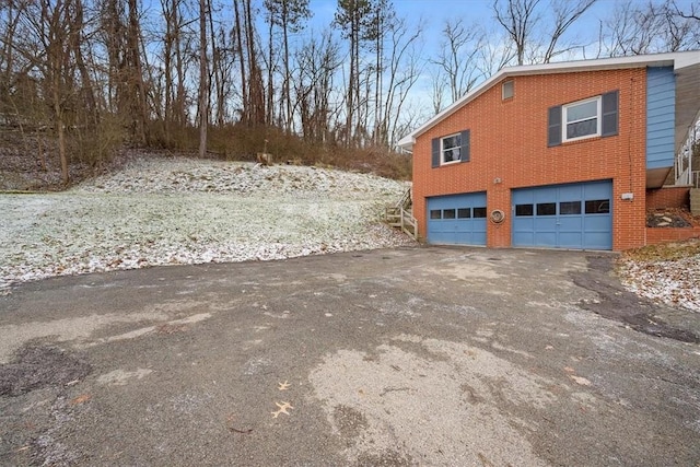 view of property exterior with a garage