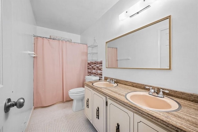 bathroom with a shower with curtain, tile patterned flooring, toilet, decorative backsplash, and vanity