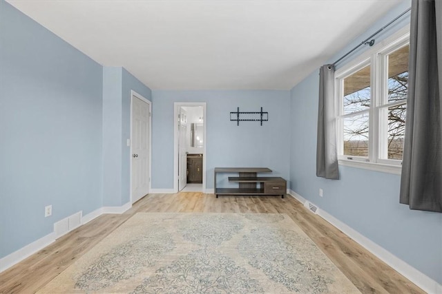 spare room featuring light wood-type flooring