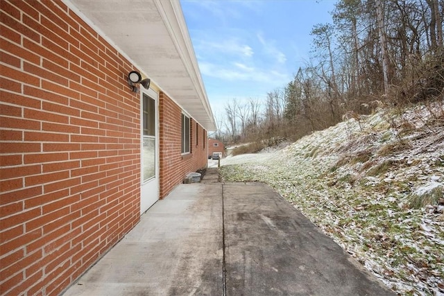 view of property exterior featuring a patio