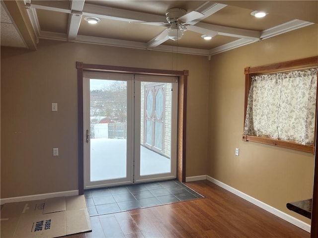 entryway featuring ornamental molding, coffered ceiling, ceiling fan, beamed ceiling, and hardwood / wood-style floors