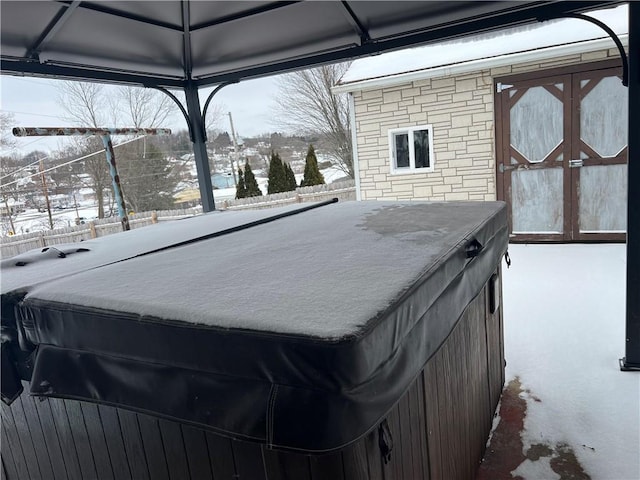 exterior space with a hot tub