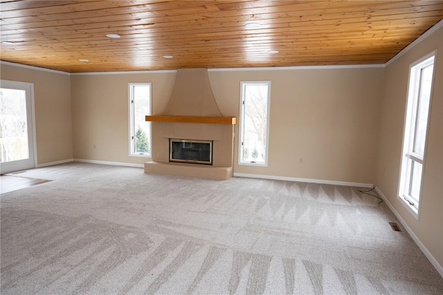 unfurnished living room with wooden ceiling, light carpet, and ornamental molding