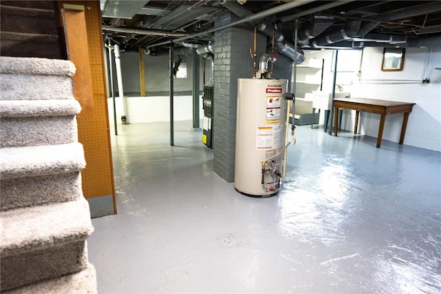 unfinished below grade area with water heater, stairway, and a sink