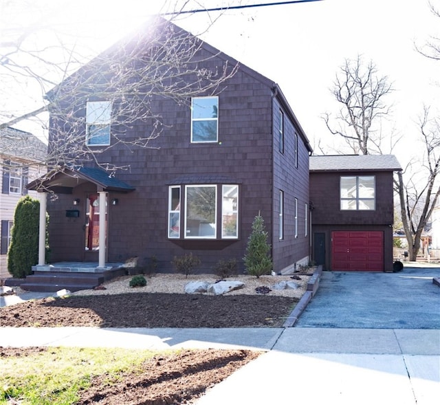 view of front of home with driveway and a garage