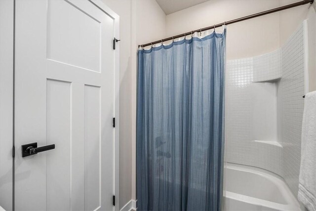 bathroom featuring shower / bath combination with curtain