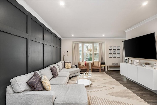 living room featuring dark wood-type flooring and crown molding