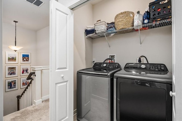 laundry room with carpet and washer and clothes dryer