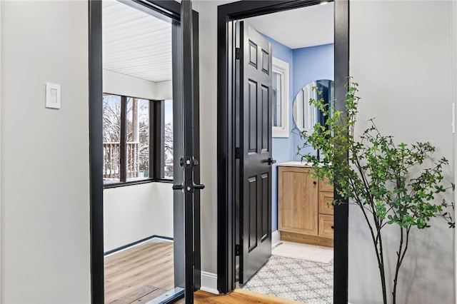 doorway to outside with light wood-type flooring