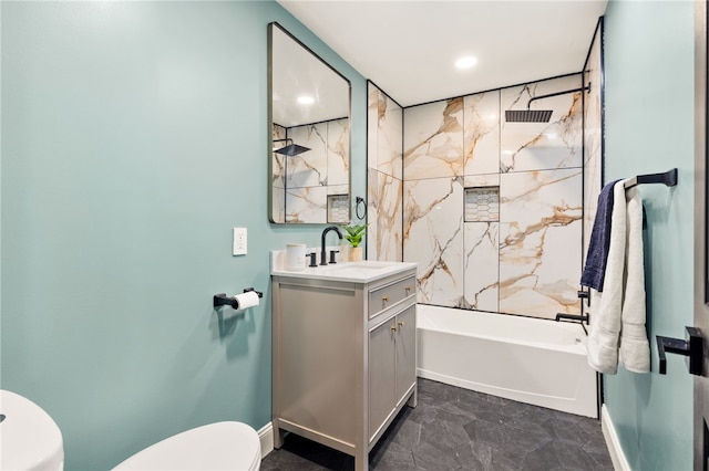 full bathroom with vanity, toilet, and tiled shower / bath