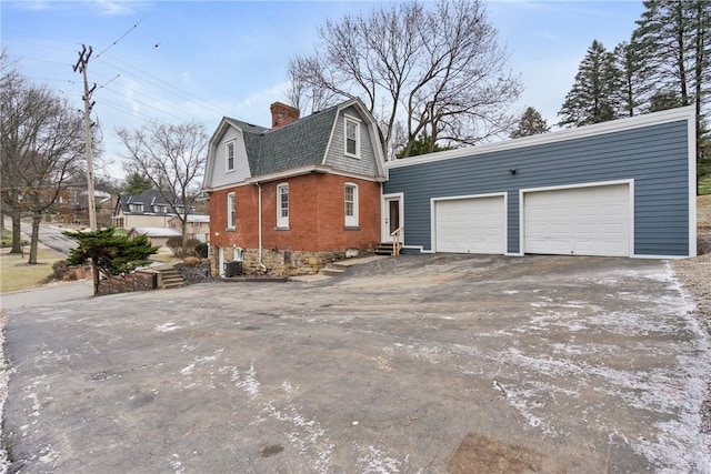 view of property exterior featuring a garage