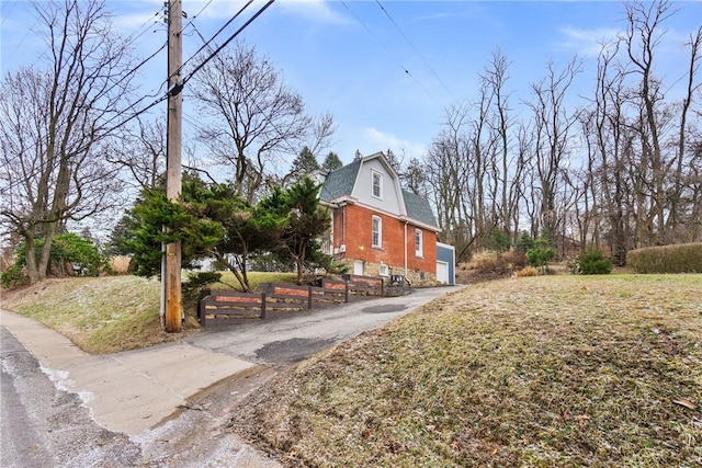 view of side of property featuring a garage