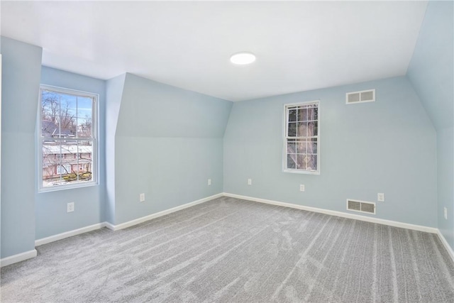 bonus room featuring carpet and lofted ceiling