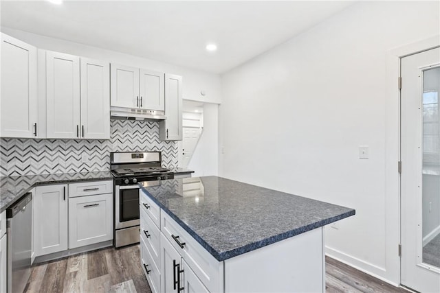 kitchen featuring a center island, stainless steel appliances, and white cabinetry