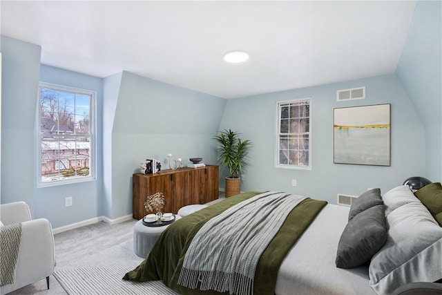 carpeted bedroom featuring lofted ceiling