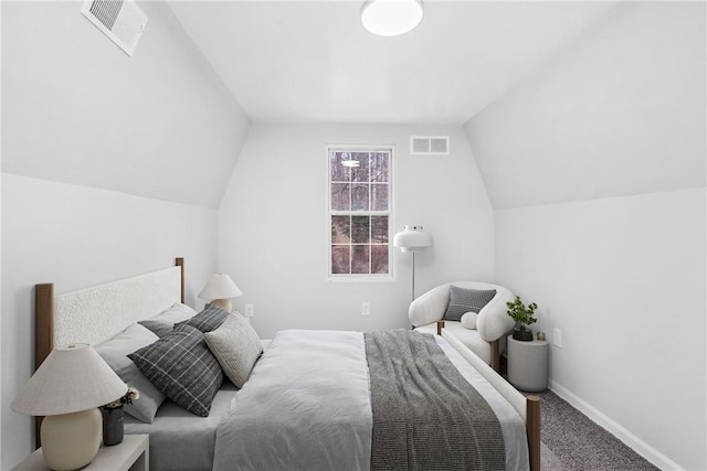 carpeted bedroom featuring vaulted ceiling