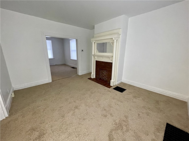 unfurnished living room featuring carpet floors