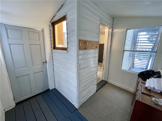 hallway with vaulted ceiling