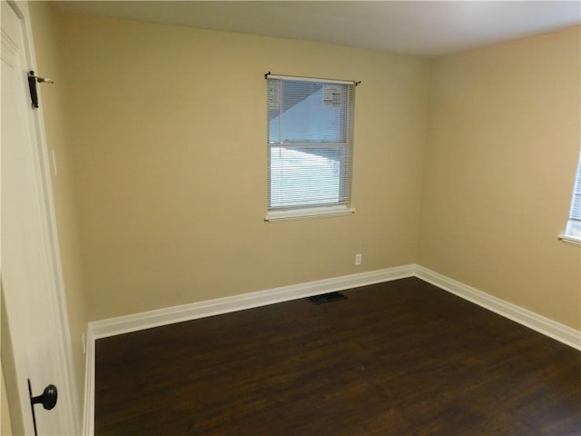 unfurnished room featuring hardwood / wood-style floors and a healthy amount of sunlight