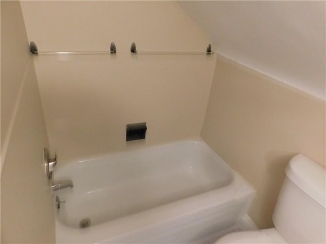 bathroom featuring a bathtub and toilet