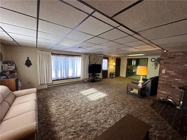 carpeted living room with a baseboard radiator and a drop ceiling