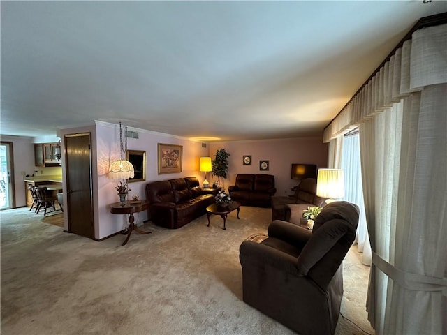 living room featuring light colored carpet and crown molding