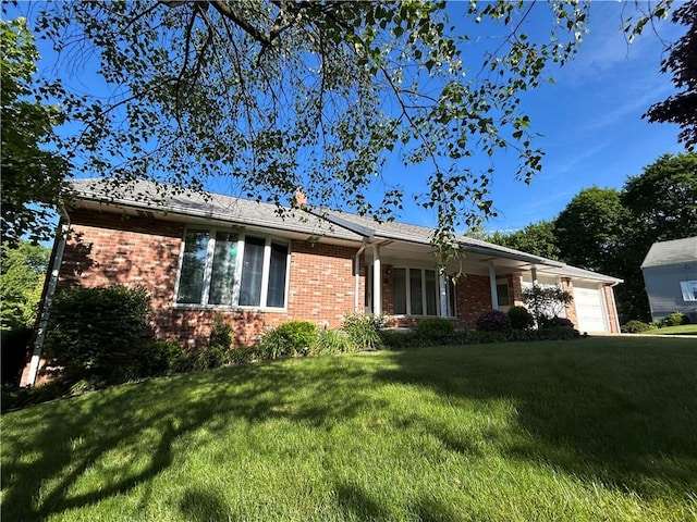 134 Shanor Hts, Center Twp But, PA 16001 - ranch-style home with brick siding, an attached garage, and a front lawn