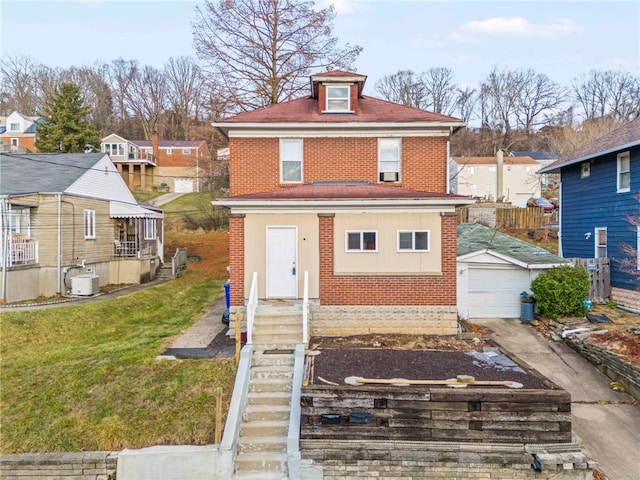 view of front of property featuring a garage, an outdoor structure, and a front lawn