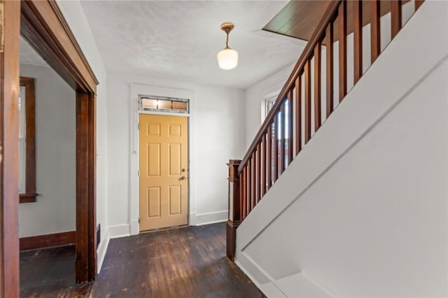 foyer entrance featuring dark hardwood / wood-style flooring