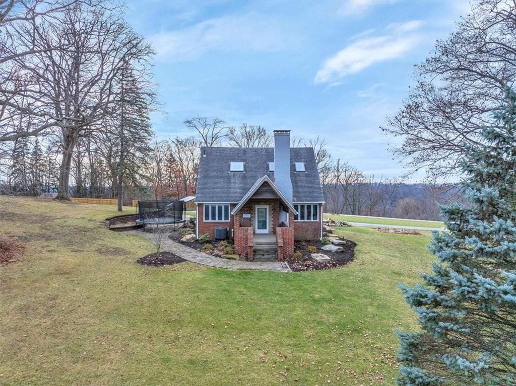 rear view of house with a lawn