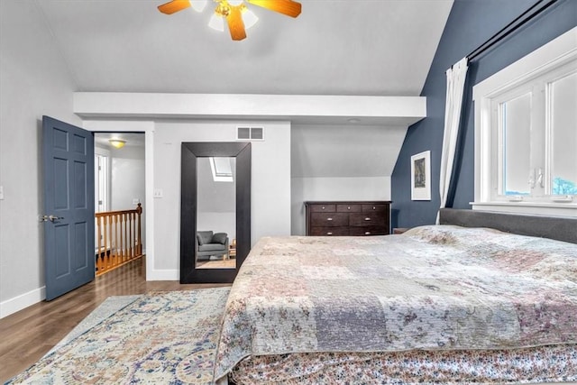 bedroom featuring ceiling fan, vaulted ceiling, and hardwood / wood-style flooring