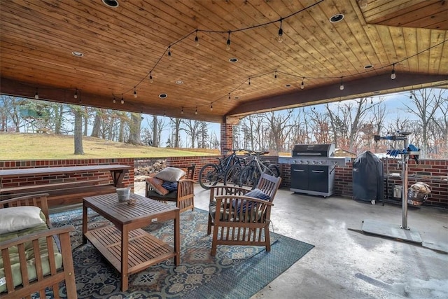 view of patio with outdoor lounge area and grilling area