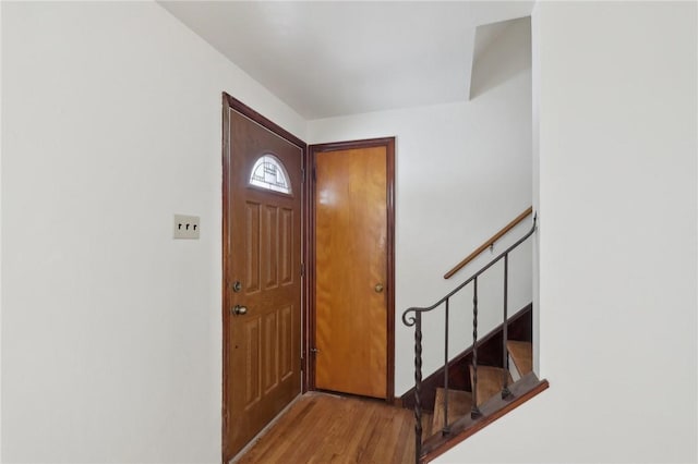 foyer entrance with light hardwood / wood-style floors