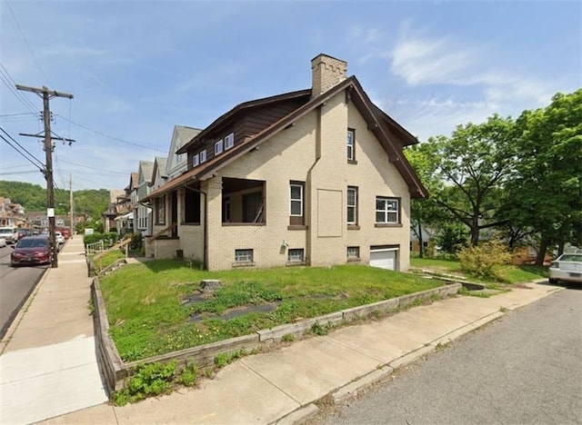 view of side of home featuring a yard