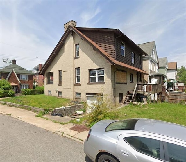 exterior space with a yard and a wooden deck