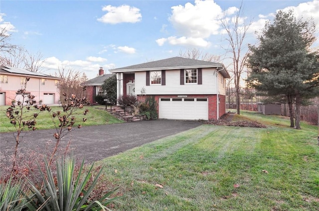 split level home featuring a garage and a front yard