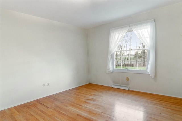 spare room featuring light wood-type flooring