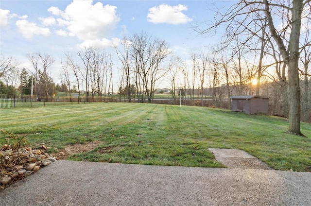 yard at dusk with a storage shed