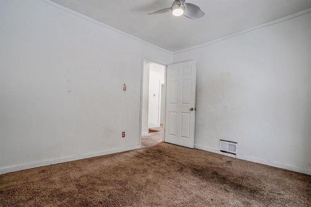 unfurnished room with carpet, ceiling fan, and crown molding