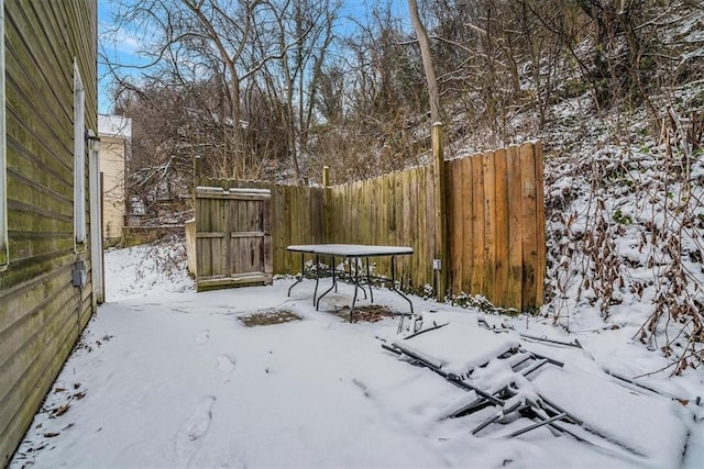 view of yard covered in snow