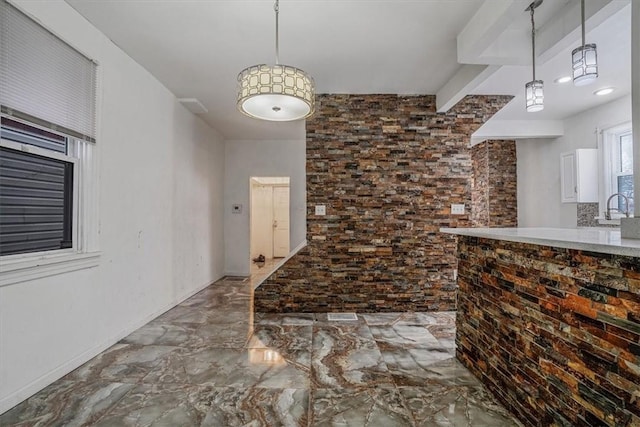 kitchen featuring sink and hanging light fixtures