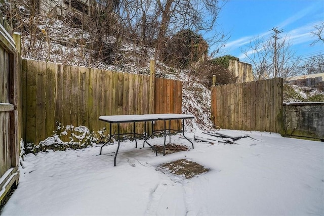 view of yard layered in snow