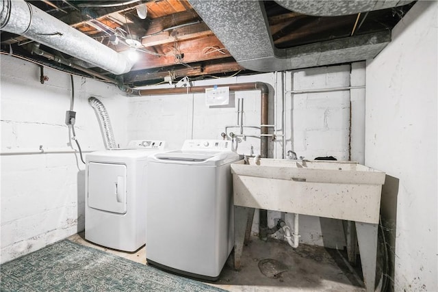 clothes washing area featuring independent washer and dryer