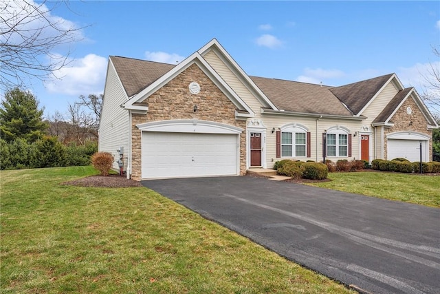 view of front of house featuring a garage and a front lawn